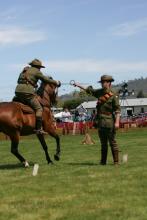 This is called an "act of faith" where one trooper holds a 4 inch diameter rope ring in his fingers and another rider will gallop through using an 1908 pattern sabre.