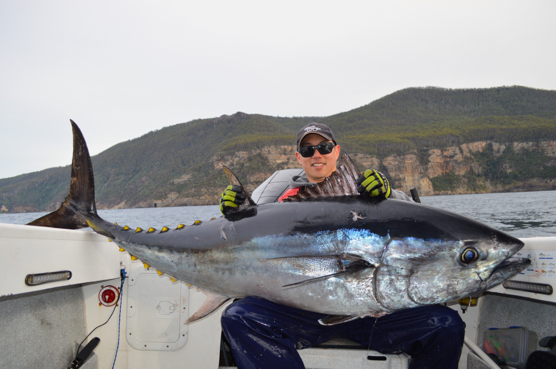 is Jonah Yick and the 87 kg Southern Bluefin Tuna he and the crew caught off Eagle Hawk Neck