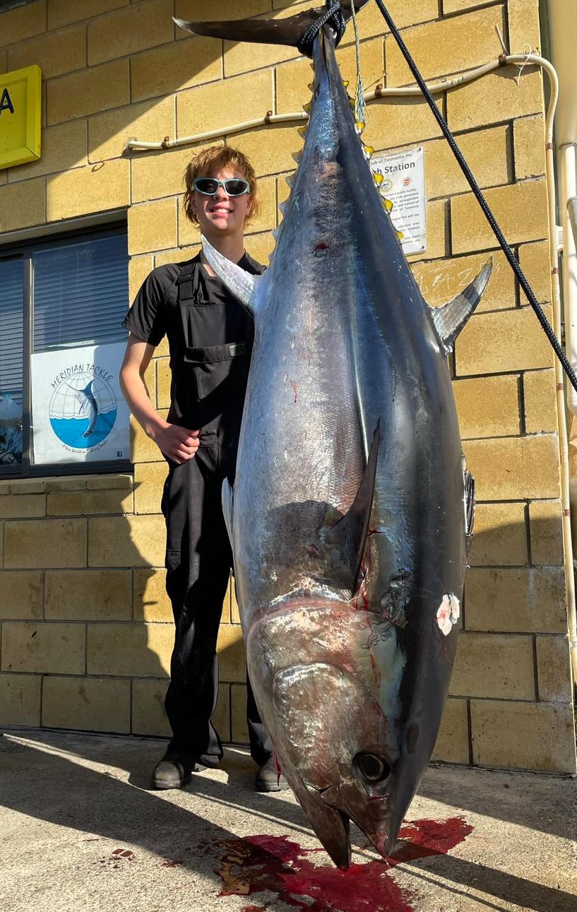 CAPTION: Lachie Clues with the 141.5 kg Southern Bluefin Tuna he landed recently from the Tasman Peninsula. Picture: Spot On The Fishing Connection.