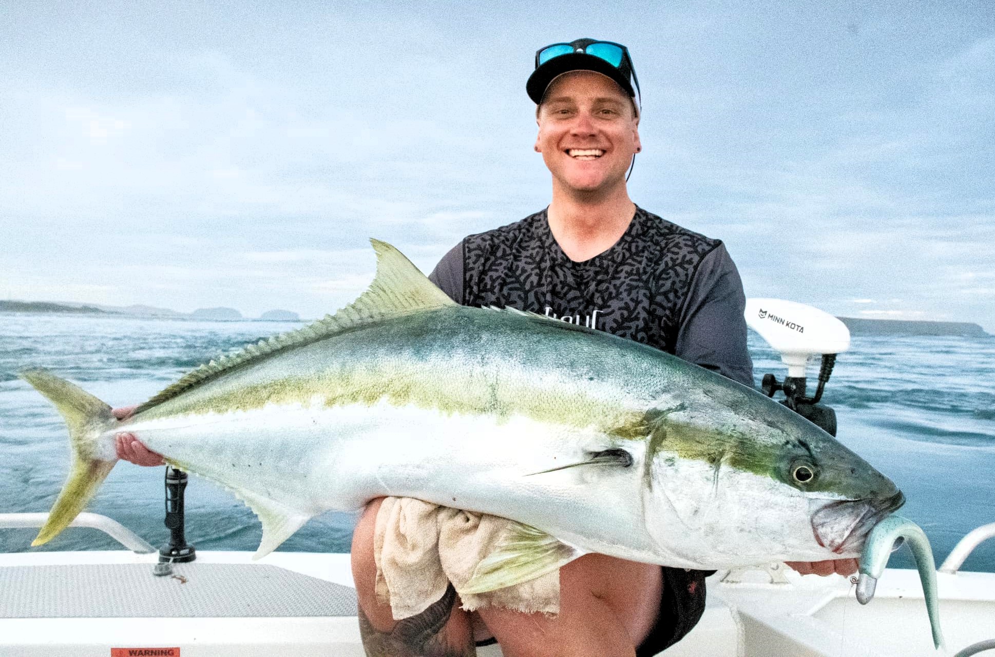 Jarvis Wall with a massive Yellowtail Kingfish that he caught and released recently in Northern Tasmania.