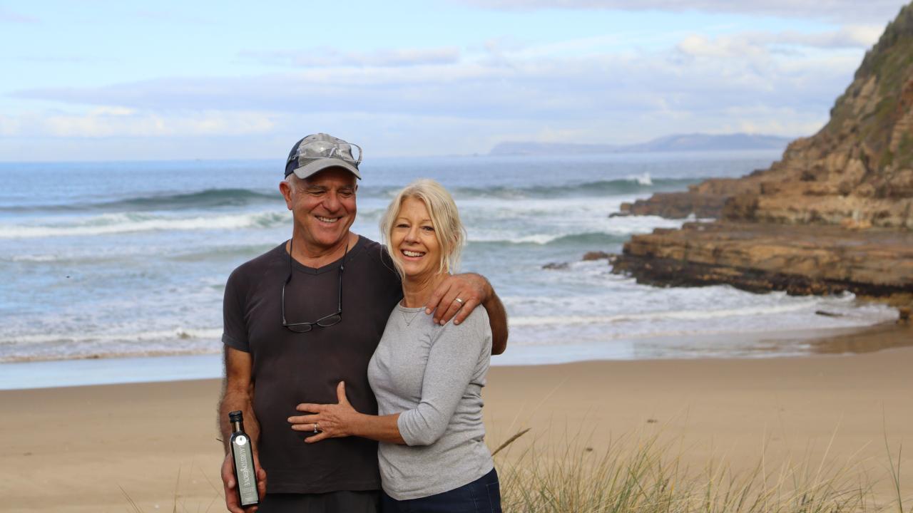 Marco and Vicki Linardi at their property surrounded by open ocean.