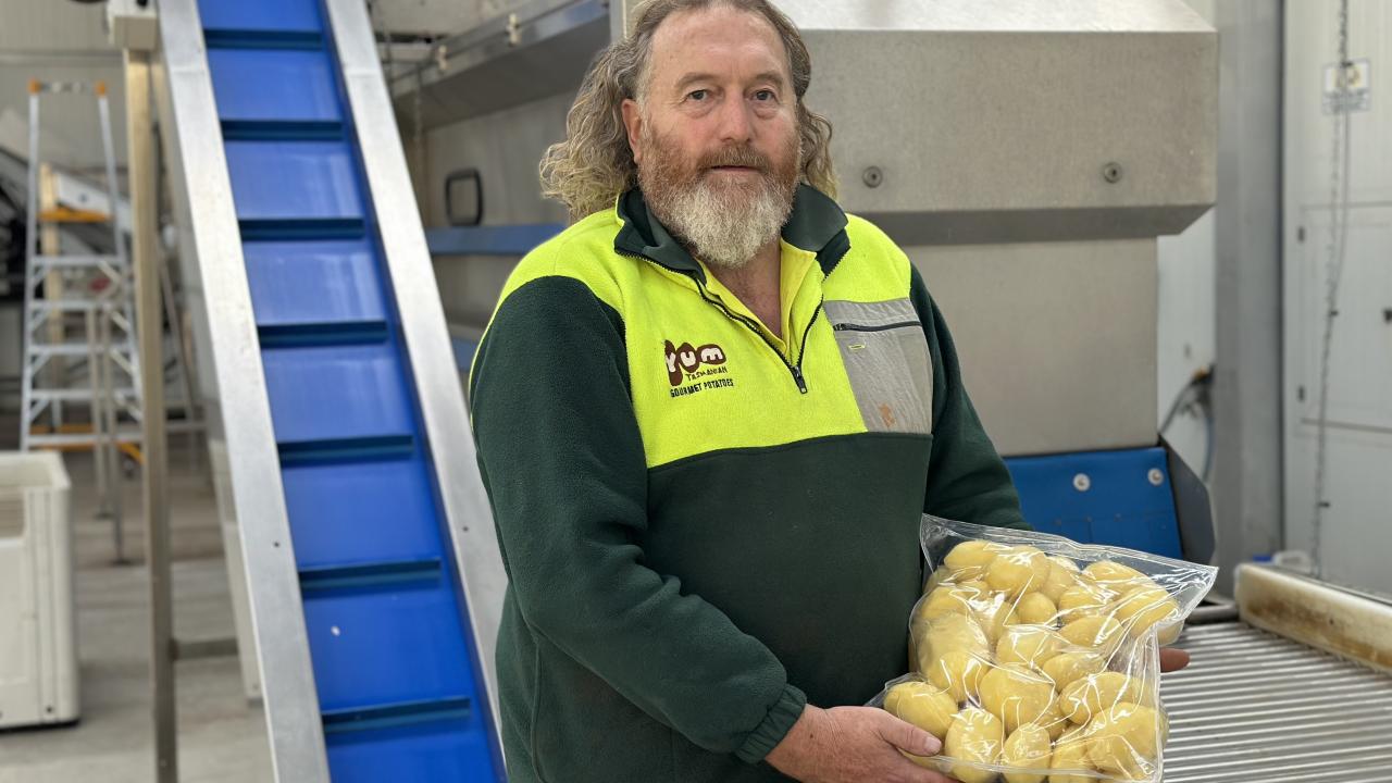 Terrence Rattray with some peeled potatoes at Yum Tasmanian Gourmet Potatoes