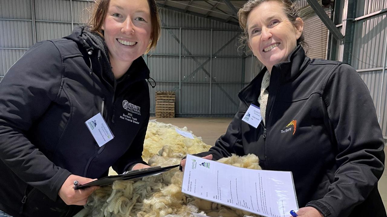 asTafe teacher and volunteer judge Evelyn Archer with Chelsea Rayner of Lower Beulah during the wool classing task.