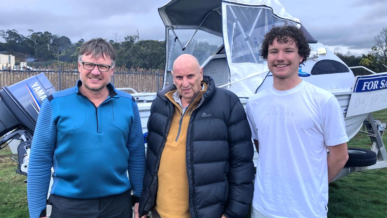 Steve De Bruyn, Pieter De Bruyn and Jak Oxford with the boat they used for a dangerous rescue