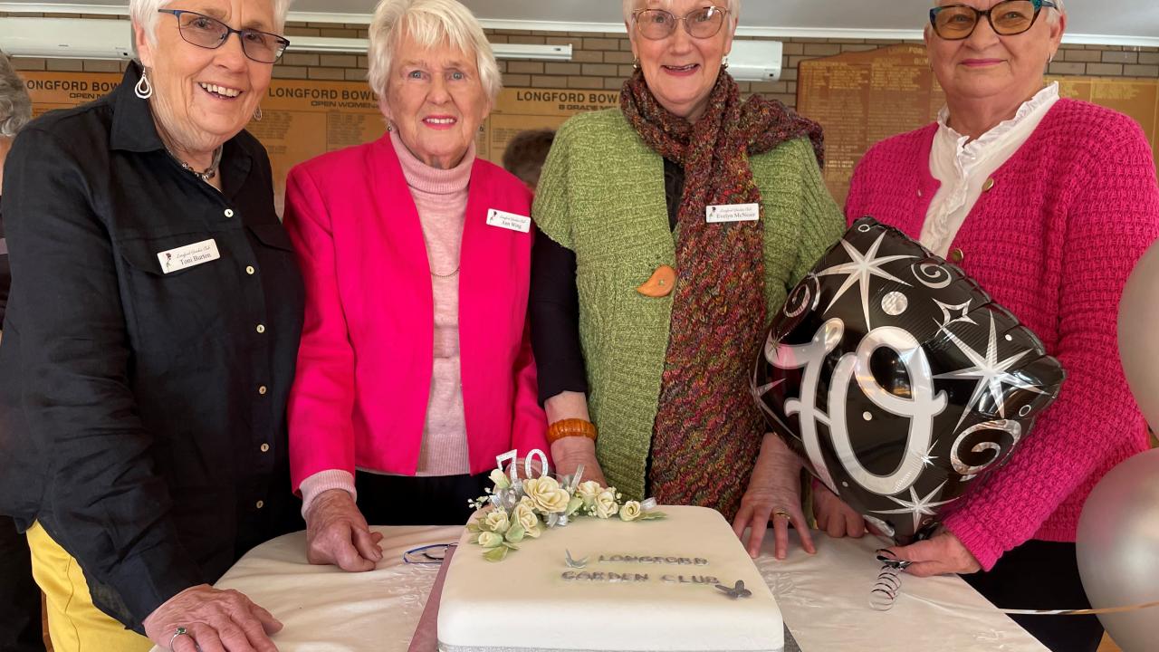 Longford Garden Club president Toni Burton, life members Ann Wing and Evelyn McNeair and life member and patron Lee de Bruyn with the 70th birthday cake.