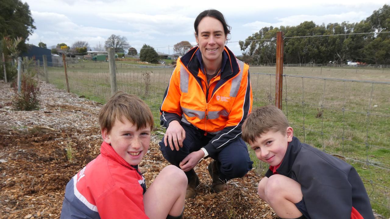 Cressy District High School students Jobe Pitchford and Hayden Fletcher with Sustainable Timber Tasmania forester, Ellen Freeman