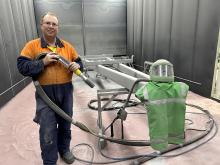 Hayward Bruckner inside the sandblasting shed at Delmade