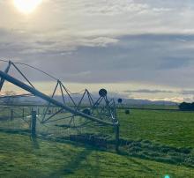 A travelling irrigator twisted by the wind in the Northern Midlands