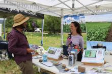 NRM Senior Project Officer Yolanda Hanusch talking to Cygnet farmer Zeb Walker.