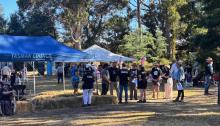 Volunteer briefing before the crowd gathers.