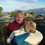 Christine Bishop with a baby goat