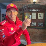 Supercars driver Will Davison toasts his grandfather Lex with a brandy at Country Club Hotel, Longford.