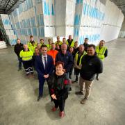 Labor senator Anne Urquhart, Salmon Tasmania CEO Luke Martin, opposition leader Dean Winter and West Coast Mayor Shane Pitt with salmon industry supporters at Polyfoam, Westbury.