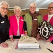 Longford Garden Club president Toni Burton, life members Ann Wing and Evelyn McNeair and life member and patron Lee de Bruyn with the 70th birthday cake.