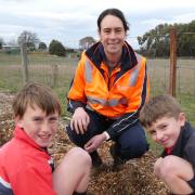 Cressy District High School students Jobe Pitchford and Hayden Fletcher with Sustainable Timber Tasmania forester, Ellen Freeman